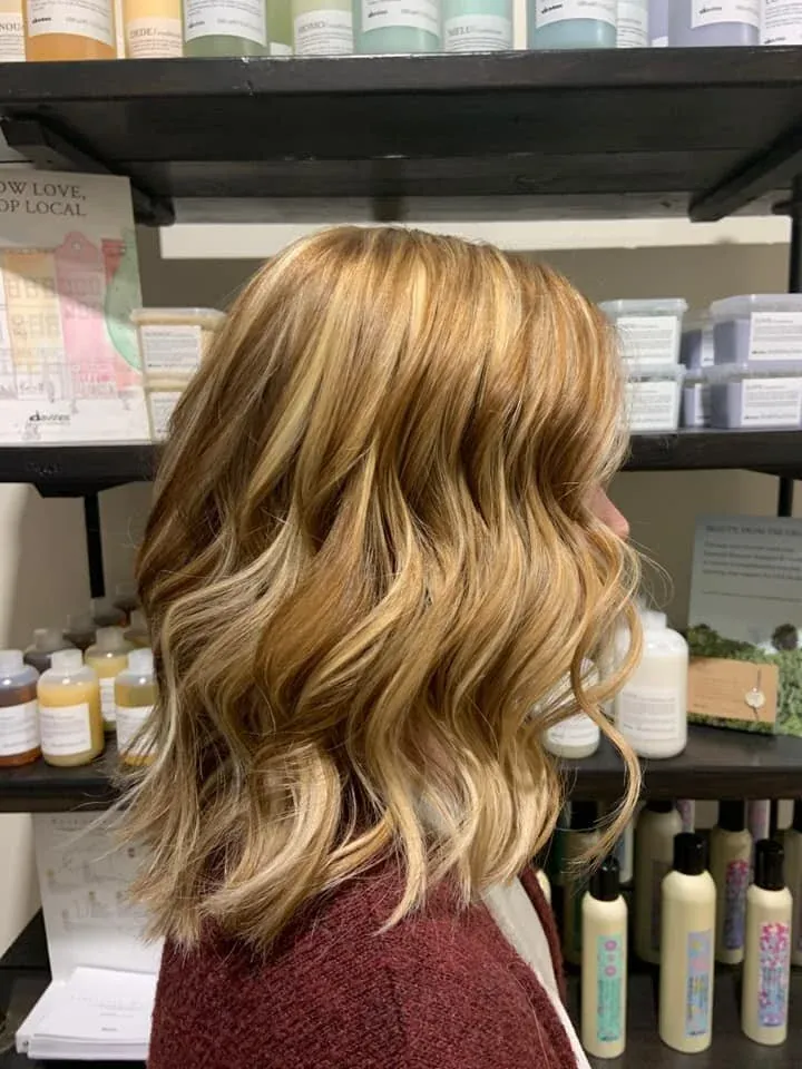 Golden blonde lob with beachy waves and hand-placed highlights, cut and styled at GreenRoom Salon & Spa, Greencastle, Indiana