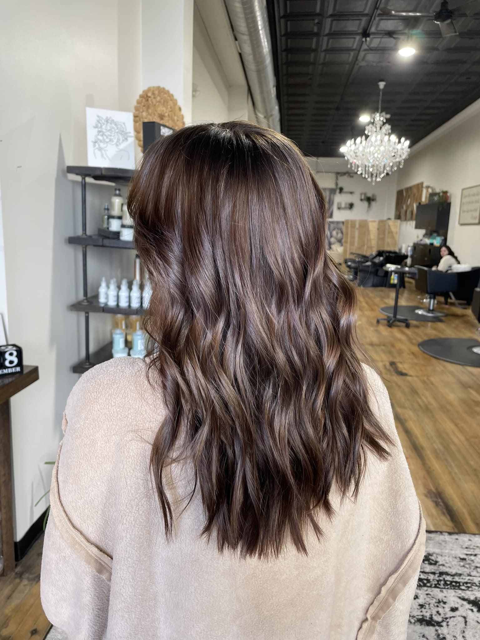 Mid-length brunette cut with soft waves and dimensional lowlights, styled at GreenRoom Salon & Spa in Greencastle, Indiana